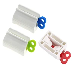 3pcs Rolling Tube Toothpaste Squeezer Toothpaste Seat Holder Stand Rotate Toothpaste Dispenser for Bathroom (Red, Blue and Green)
