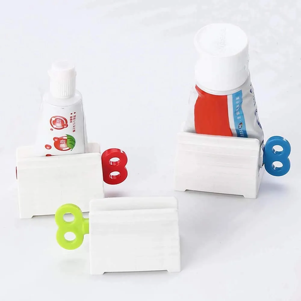 3pcs Rolling Tube Toothpaste Squeezer Toothpaste Seat Holder Stand Rotate Toothpaste Dispenser for Bathroom (Red, Blue and Green)
